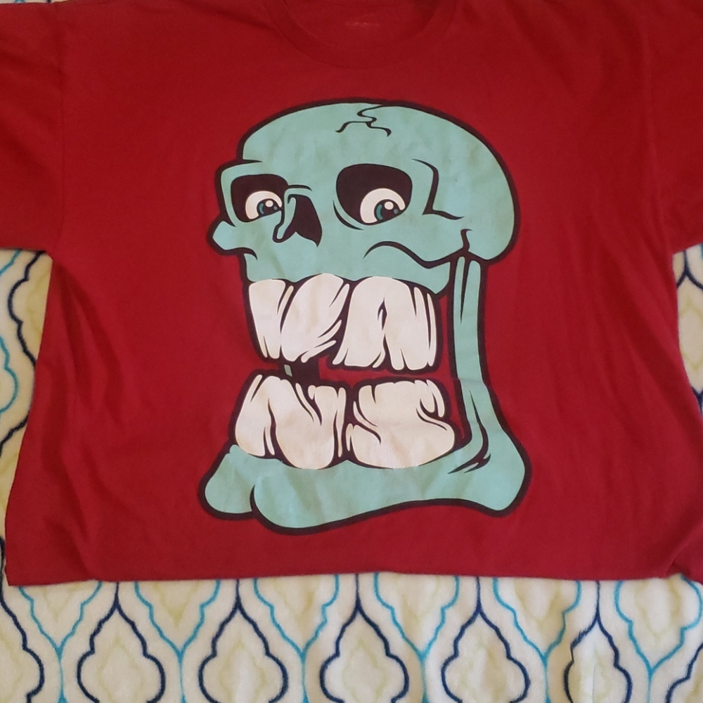 Vans red with a skull print tee-shirt.    Size L
